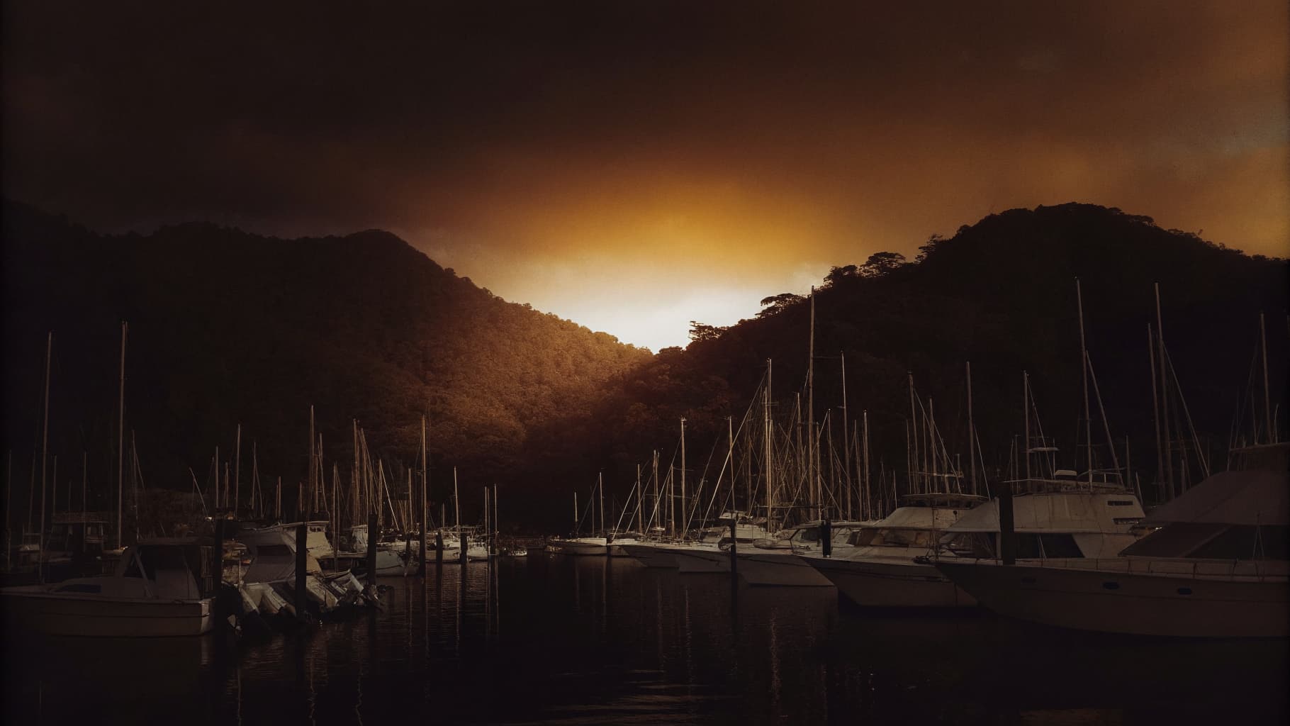 Charter fishing fleet docked at Marina Pez Vela in Quepos, Costa Rica at dusk
