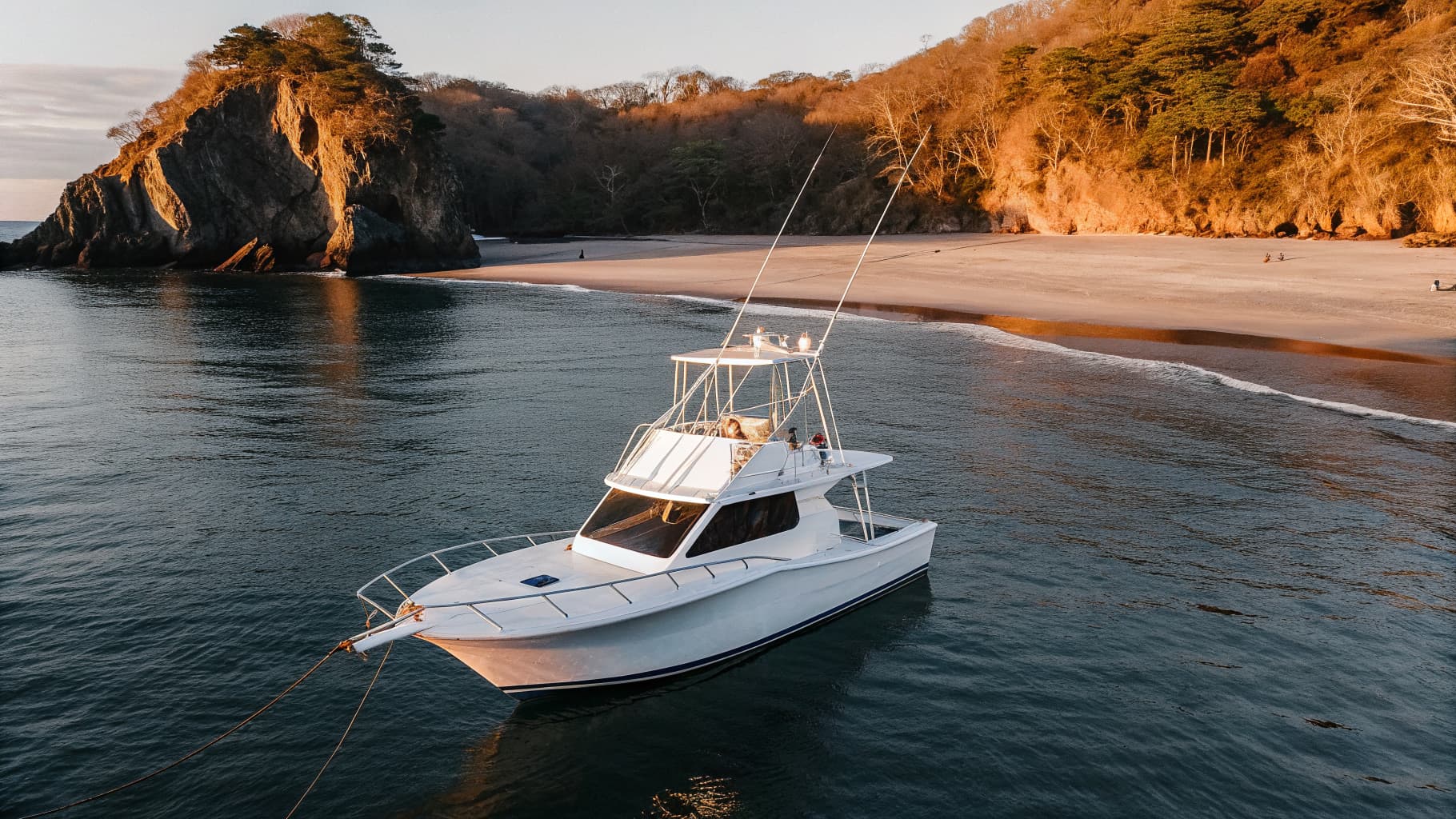 Sportfishing boat anchored near a secluded cove close to Manuel Antonio National Park, Costa Rica
